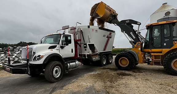 1105 truck with the mixer getting dumped into.