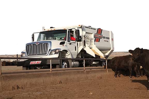 620-16 truck with the mixer feeding cattle.