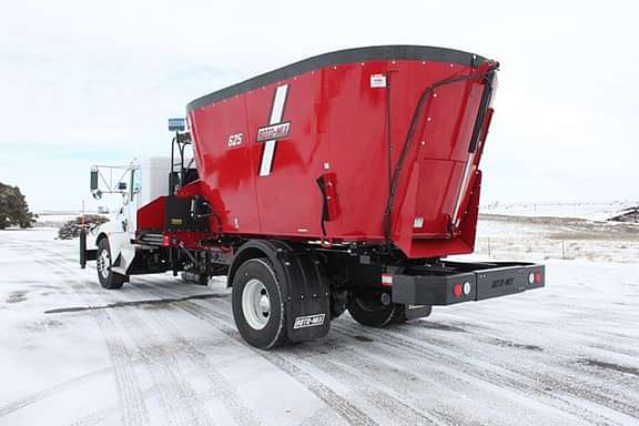 625 mixer trailer with the truck in the snow.