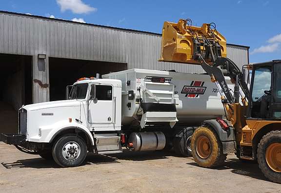 720-16 truck with the mixer getting dumped into.