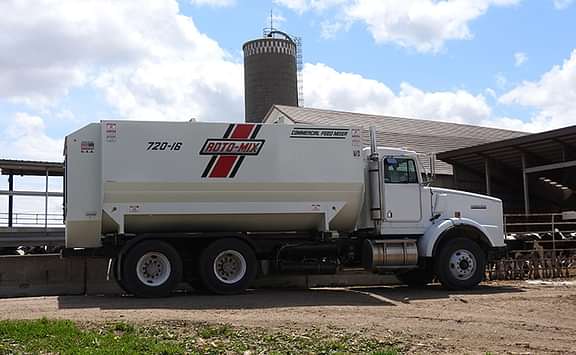 720-16 truck with the mixer feeding cattle.