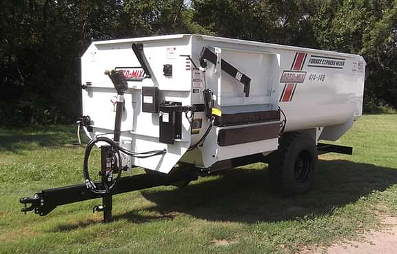 414 trailer sitting in the grass.